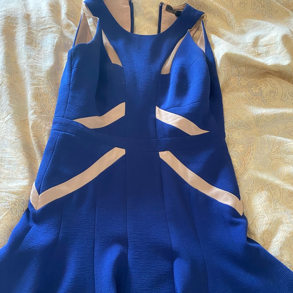 High quality blue cut out dress perfect for parties or homecoming dances.